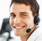 Closeup of smiling customer service executive with headphones